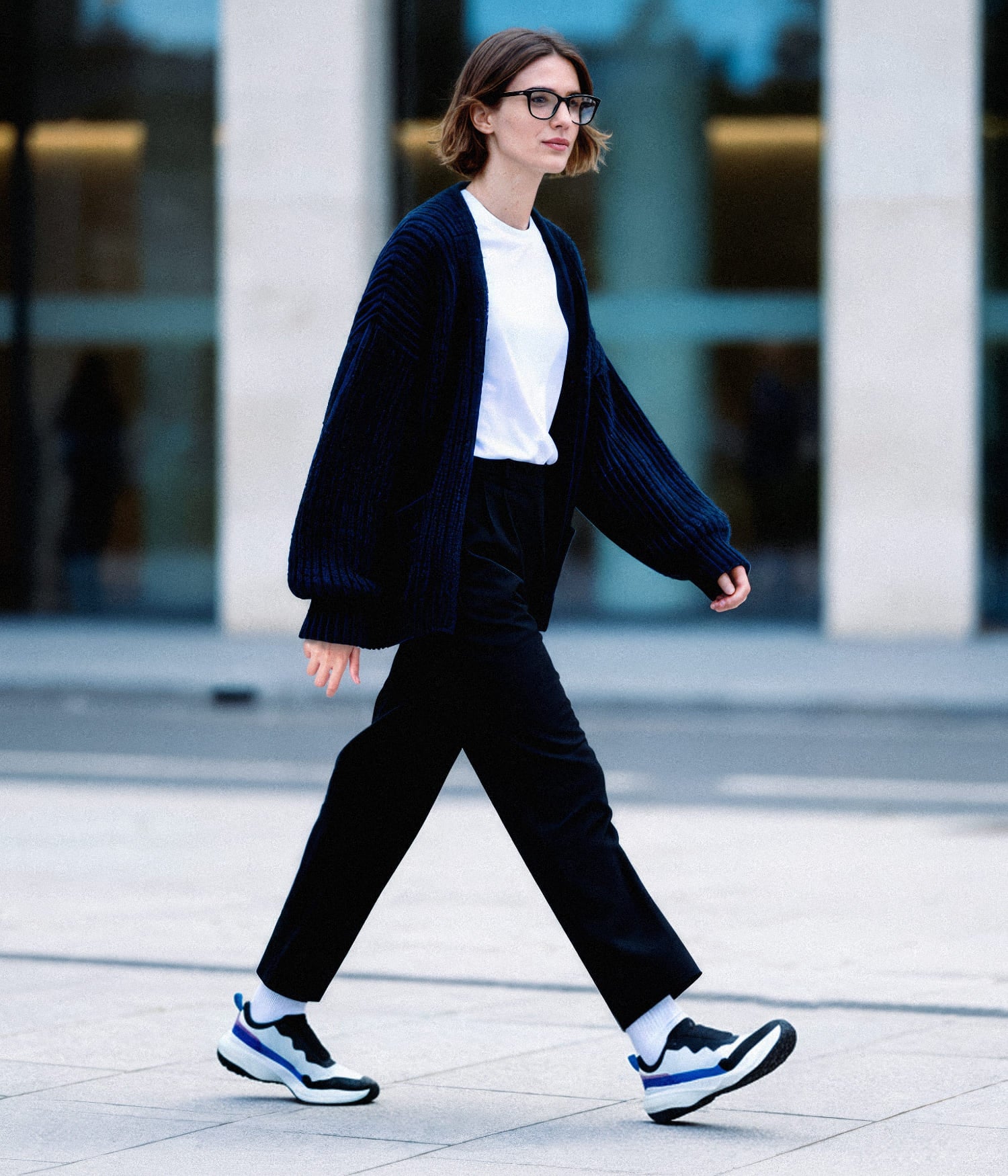 wearing lightweight S-16 White slip-on walking shoes, perfect for comfortable city commuting.