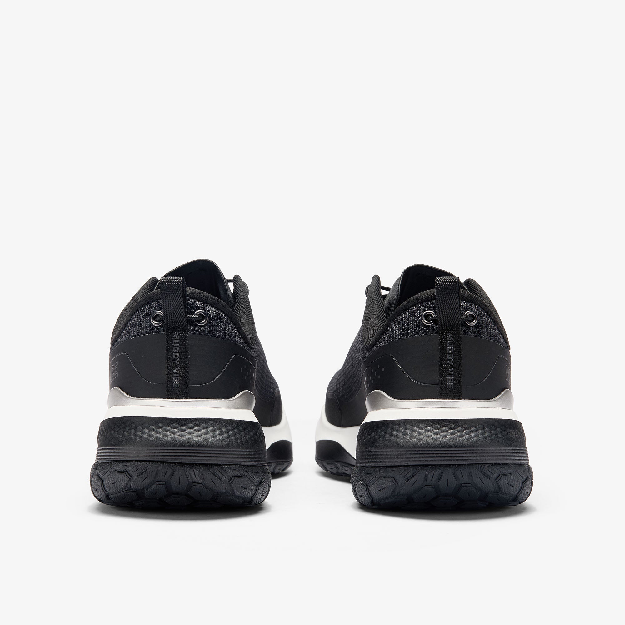 MUDDY VIBE S-16 Ridge Snow low-top hiking shoe with black and white accents, rear view on a white background.