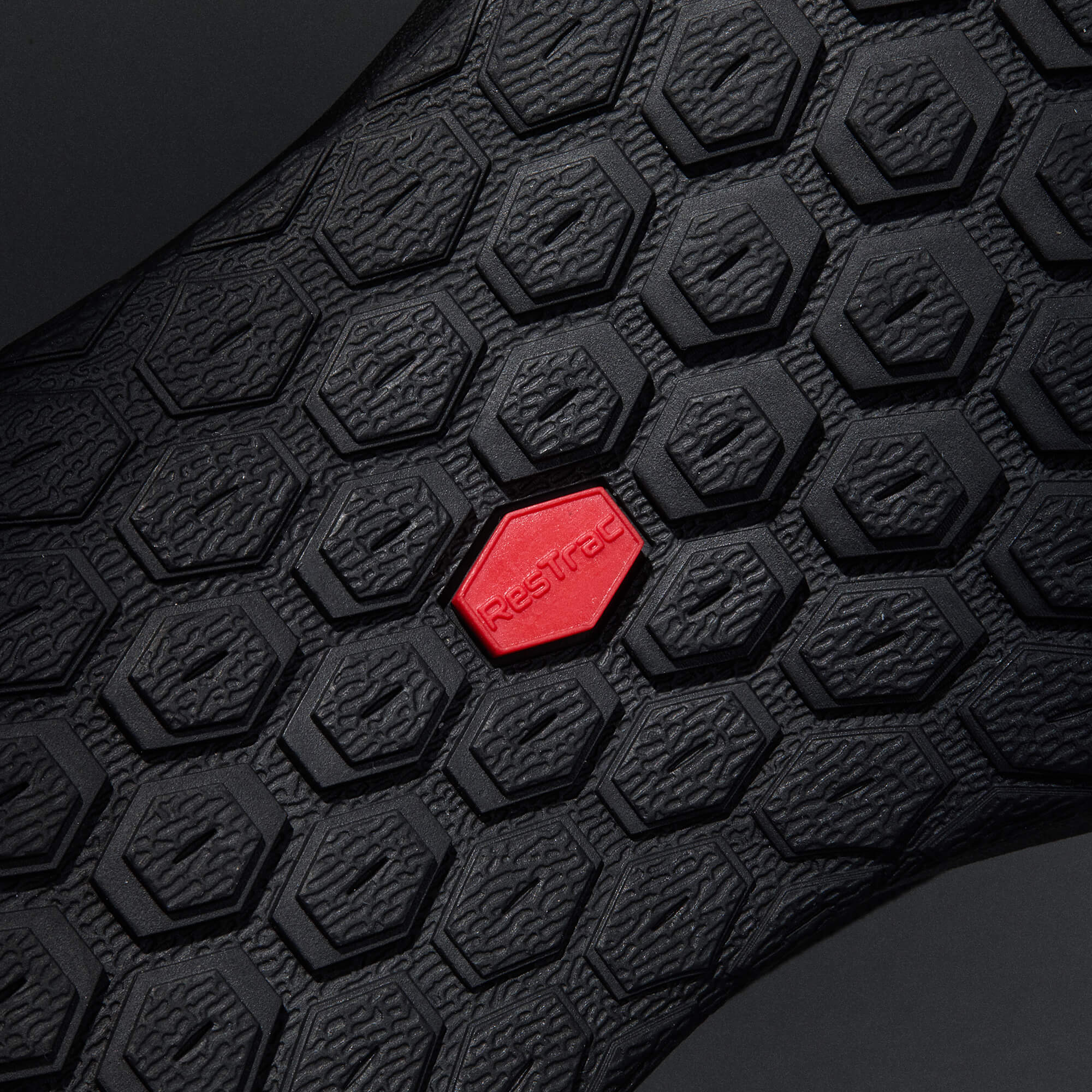 MUDDY VIBE S-16 Ridge Snow low-top hiking shoe with red accents, bottom view on a soft shadow background.