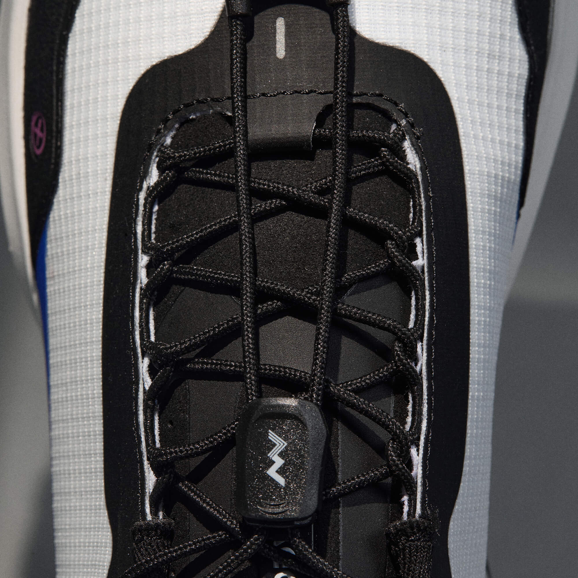 MUDDY VIBE Si-14 Aurora White low-top hiking shoe, laces detail view on a soft shadow background.