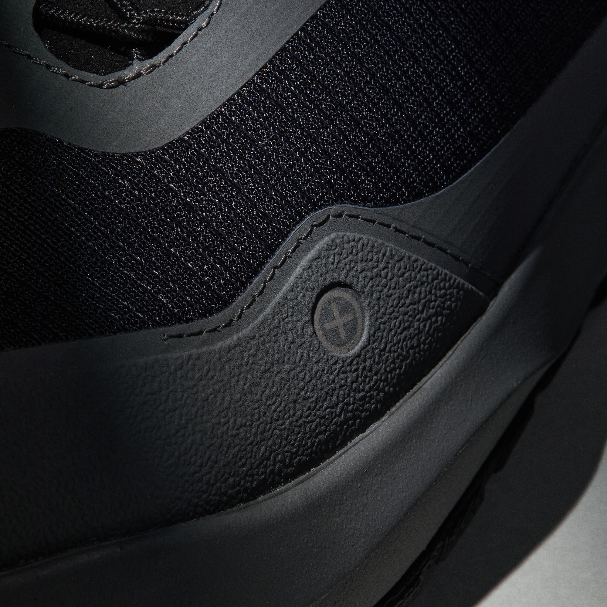 MUDDY VIBE Si-14 Tide Rock low-top hiking shoe with black and grey accents, icon view on a soft shadow background.