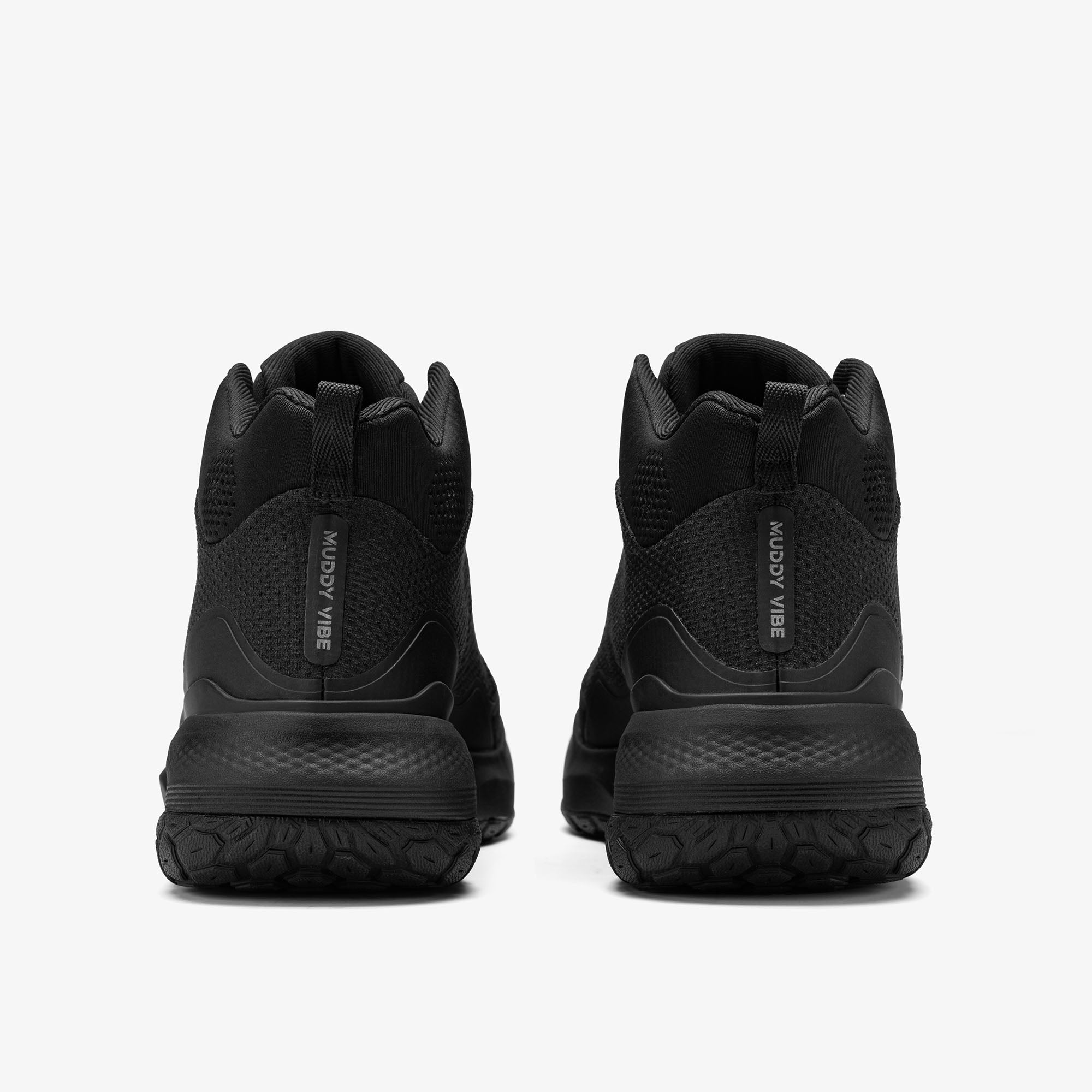 MUDDY VIBE Zn-30 Black Summit mid-top hiking shoe with with all-black trim, rear view on a white background.