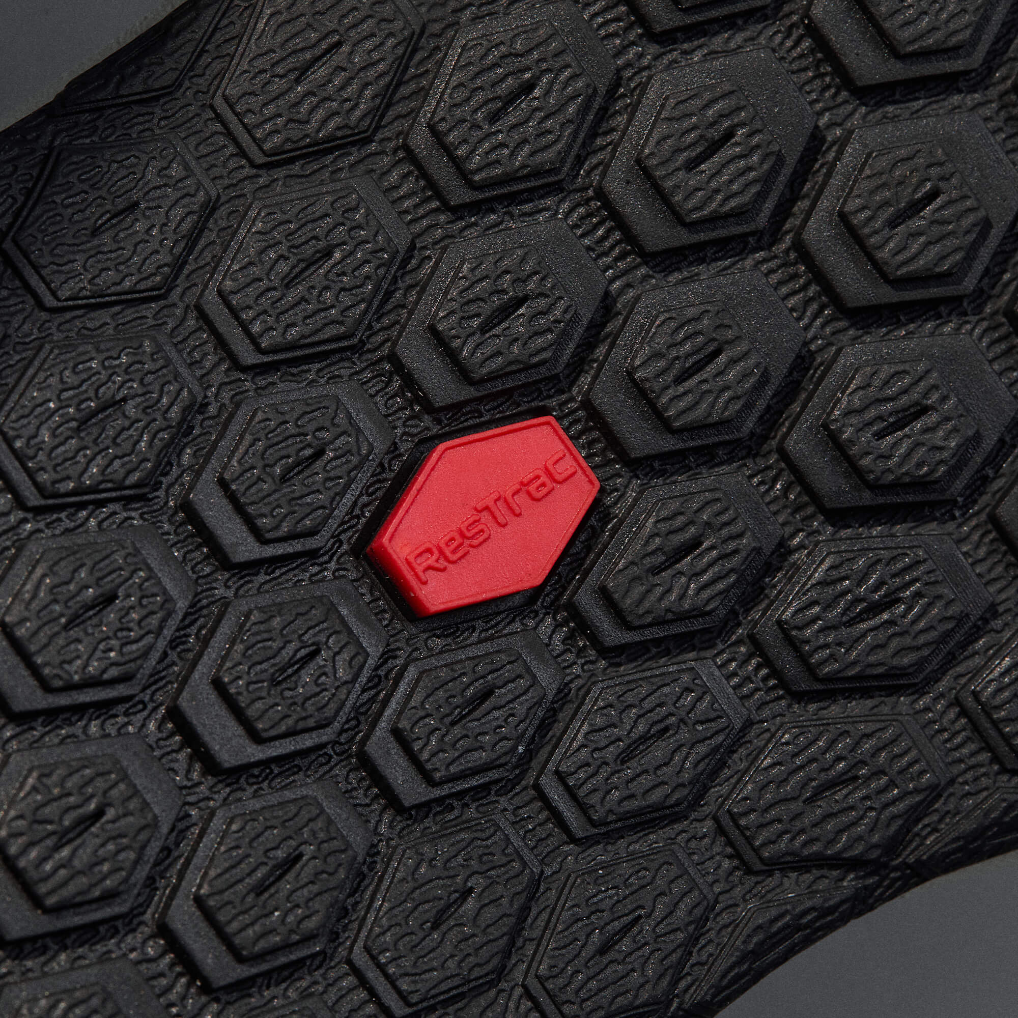 MUDDY VIBE Zn-30 Black Summit mid-top hiking shoe with with all-black trim, bottom view on a soft shadow background.