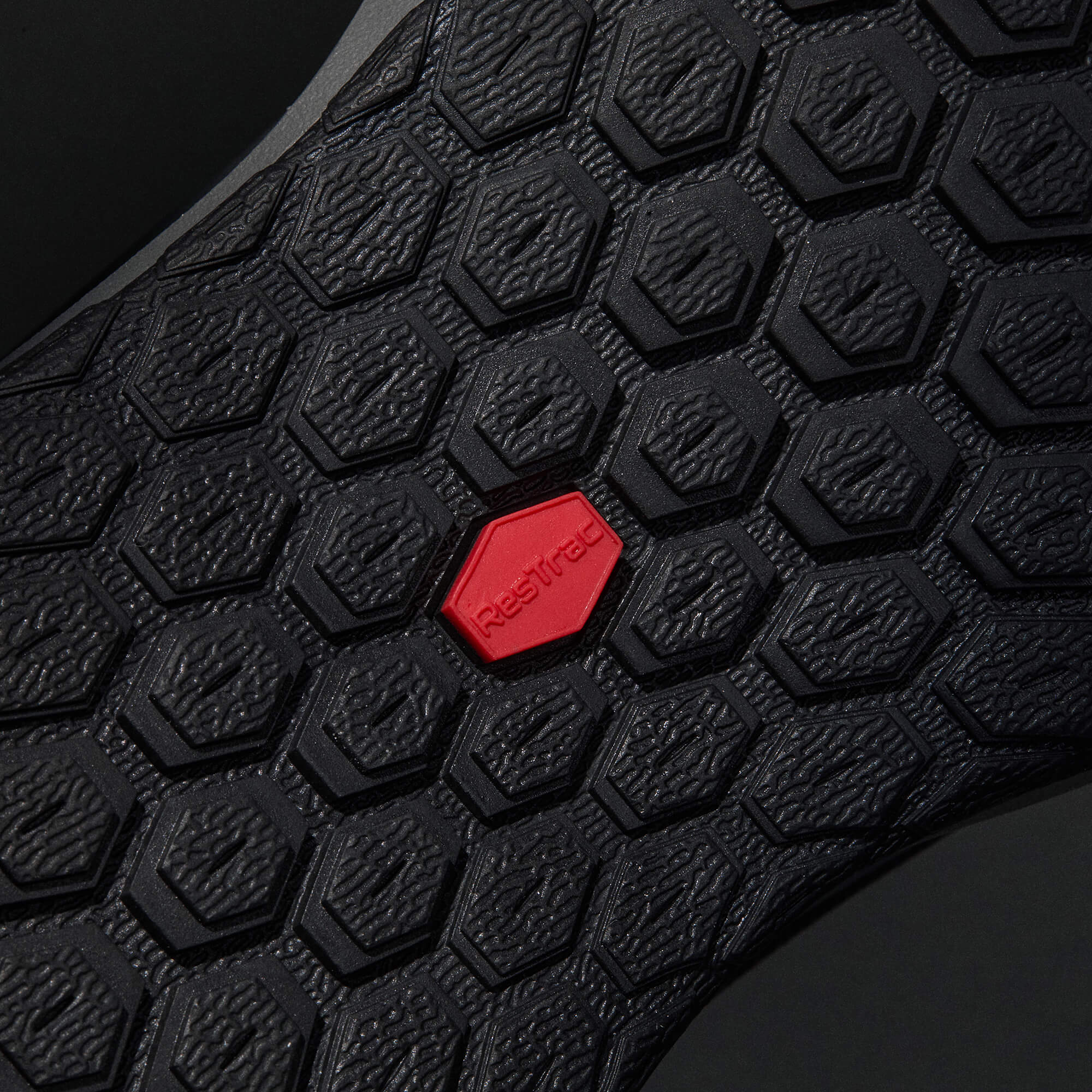 MUDDY VIBE Zn-30 Cliff Grey mid-top hiking shoe with red TesTrac traction, bottom view on a soft shadow background.